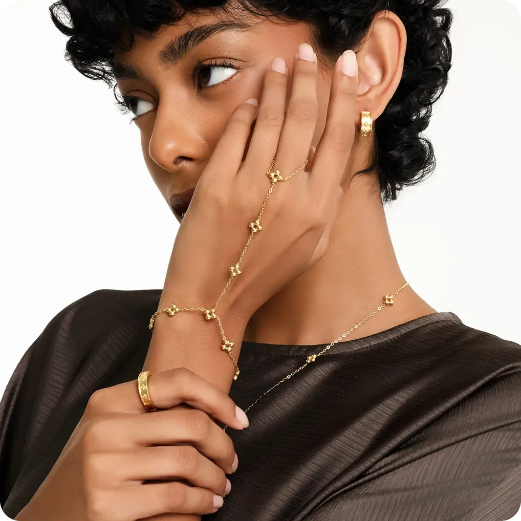 Nominal — gold hand chain and rings